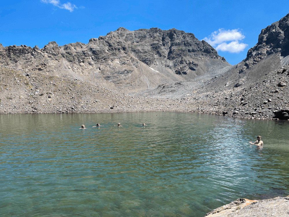 Seibert Media Alps hike - hikers having a swim in a mountain lake