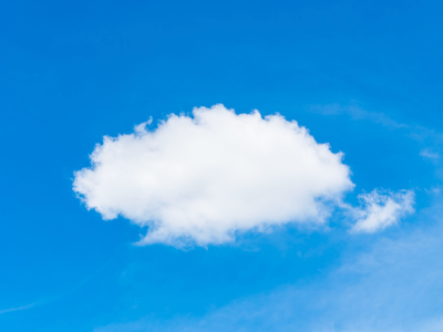 How modern Cloud software makes hybrid work models possible - image of cloud in bright blue sky