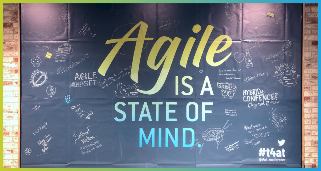 Agile is a State of Mind - Call for Sessions for the Tools4AgileTeams 2023 - very large poster on the wall with the theme of T4AT 2023, Agile is a state of mind, written on it